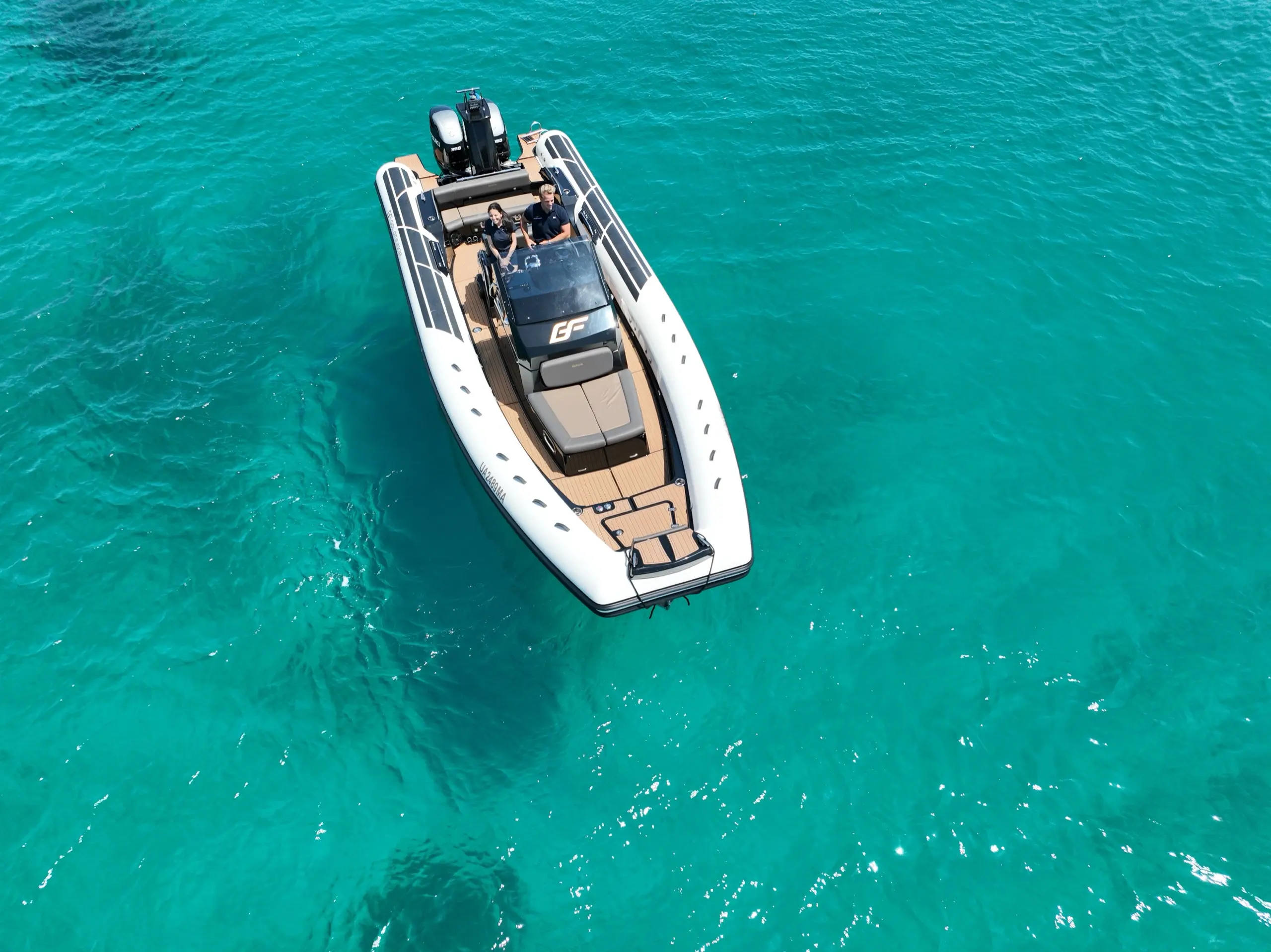 Aerial drone view of Brig Eagle 10 RIB in turquoise Sardinian water