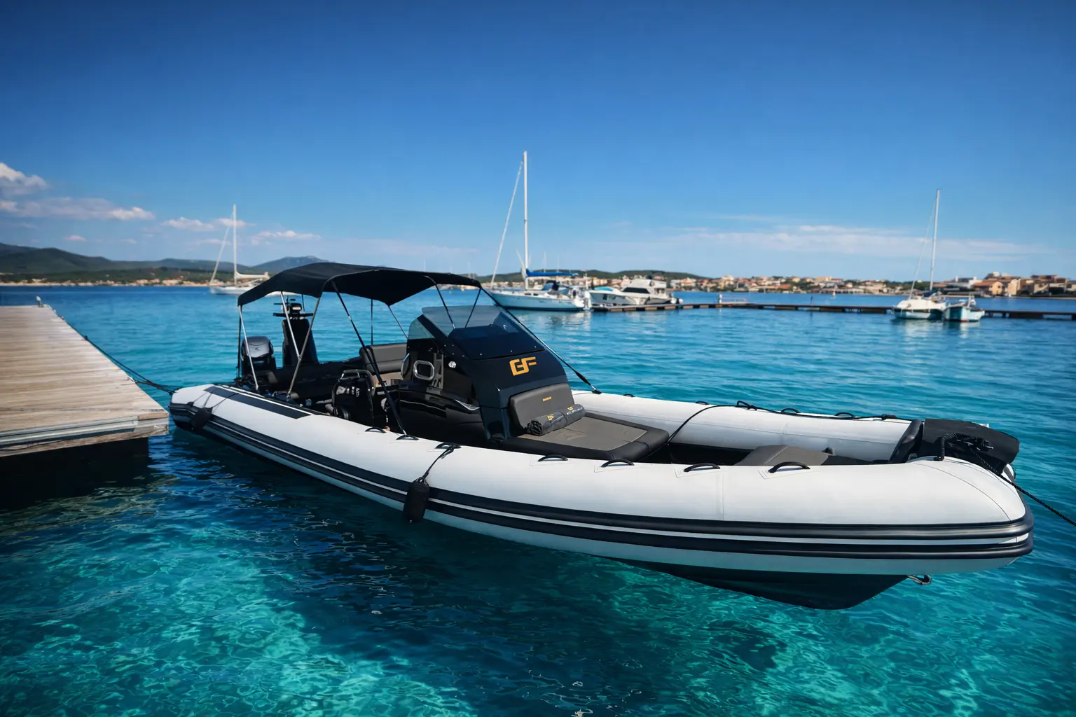 Brig Eagle 10 moored at Golfo Aranci marina with bimini top deployed