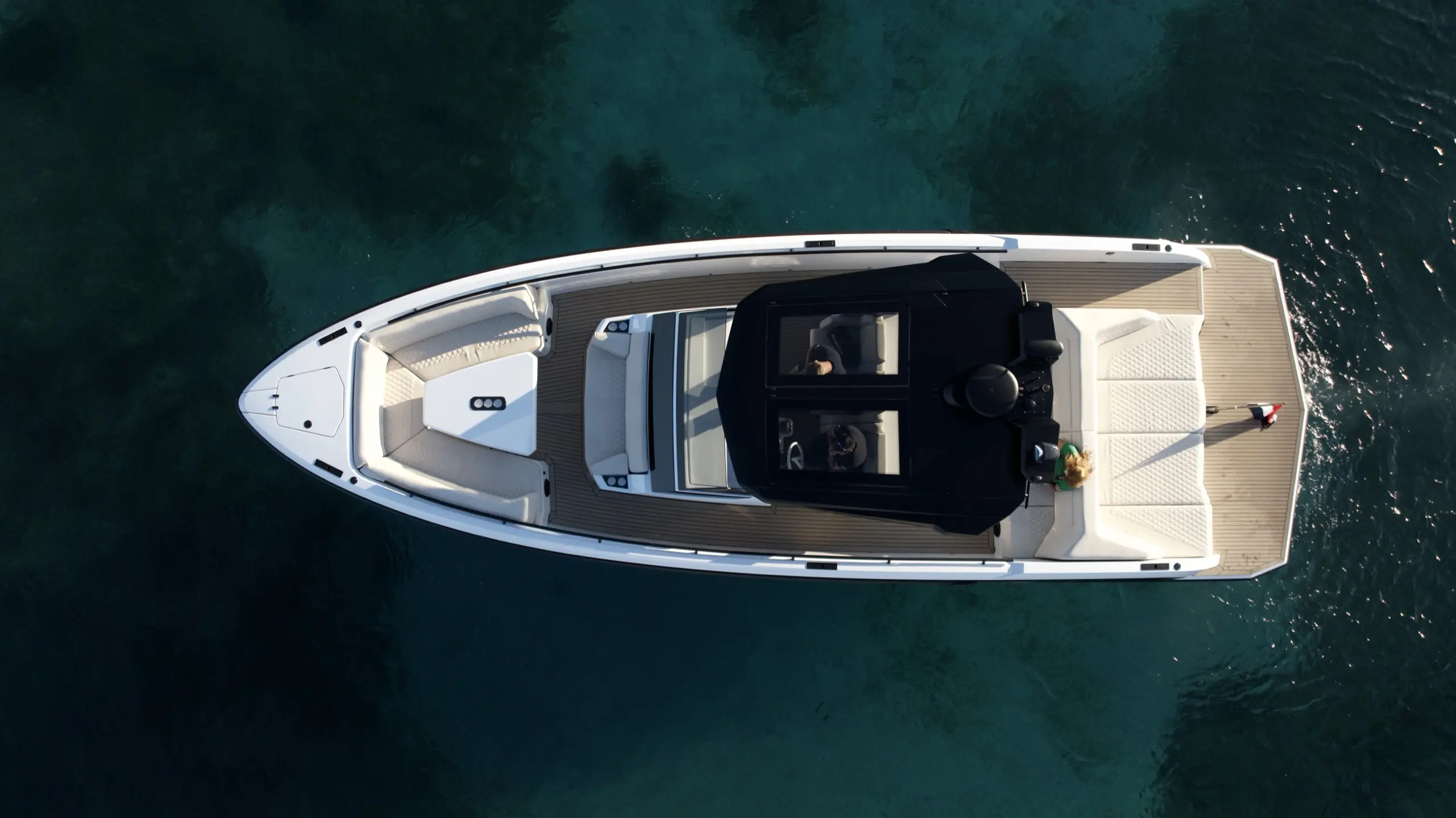 Aerial top-down view of Vanquish VQ40 yacht with teak deck and sun loungers