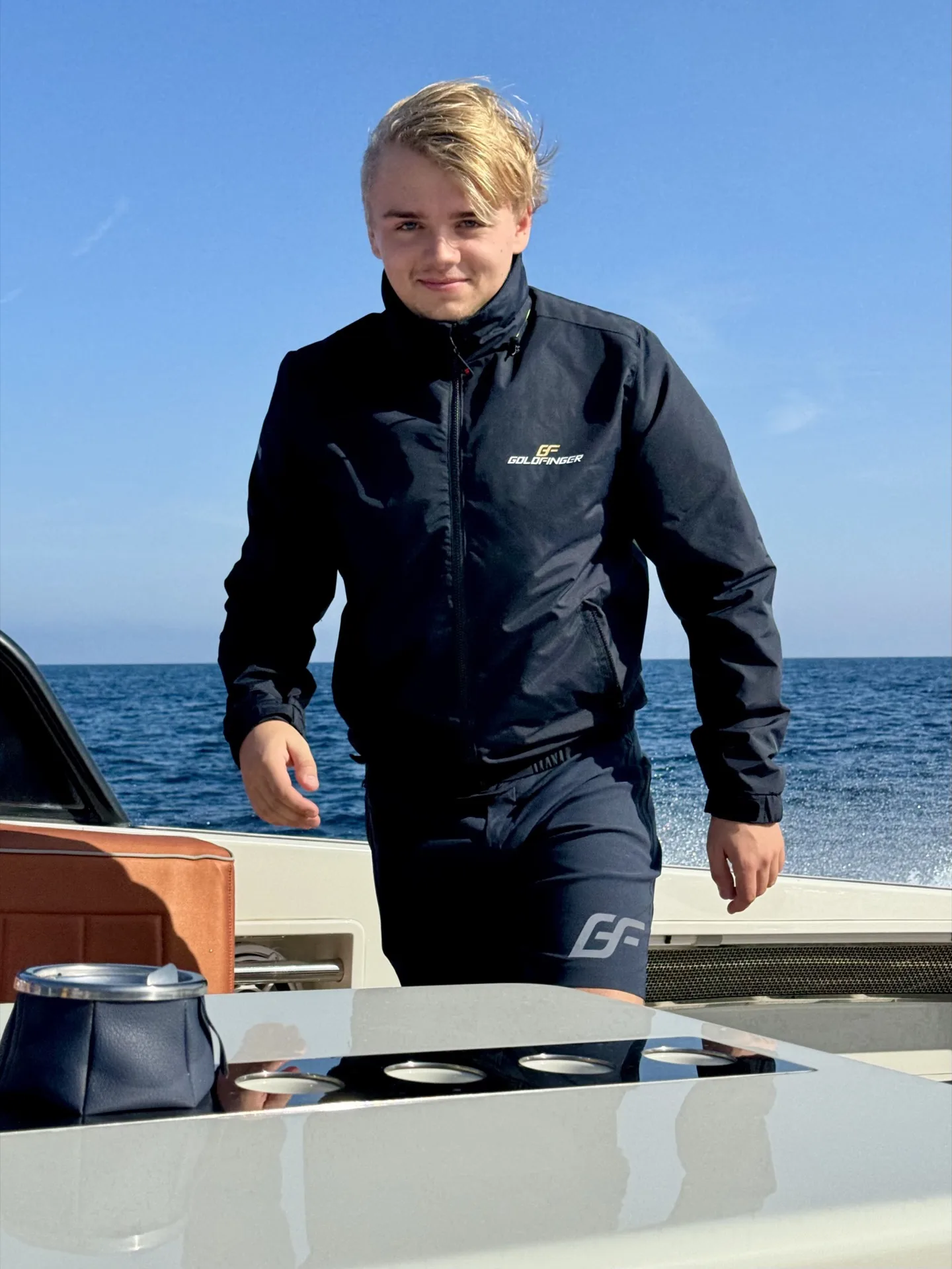 Valentijn, MareFun captain, standing on deck in his crew jacket at sea